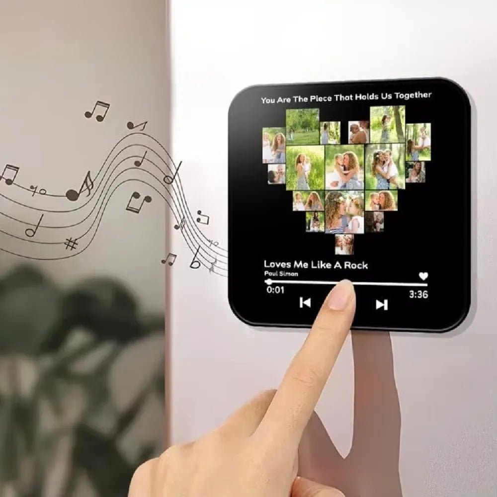 Hand pressing a physical button on a personalized music magnet to play pre-recorded songs instantly without QR codes