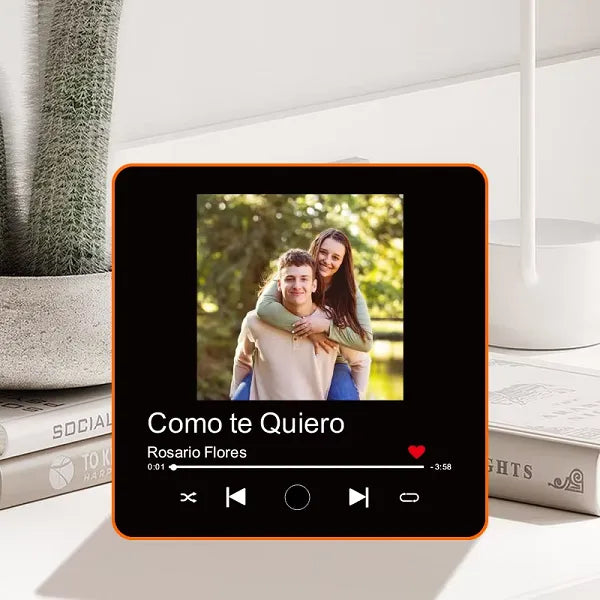 A personalized fridge magnet with a photo and a button that plays music when pressed